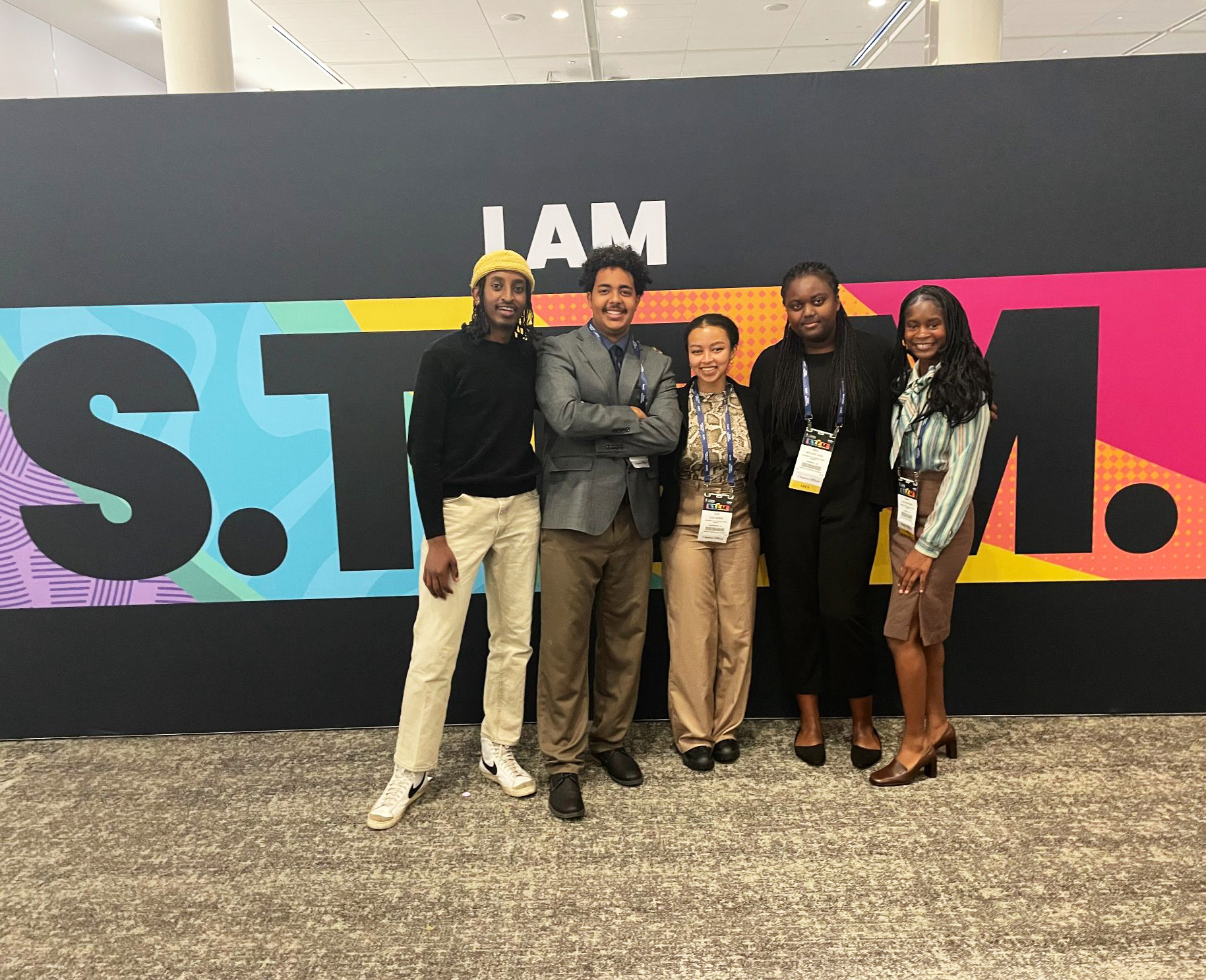 group of NSBE student in front of STEM sign