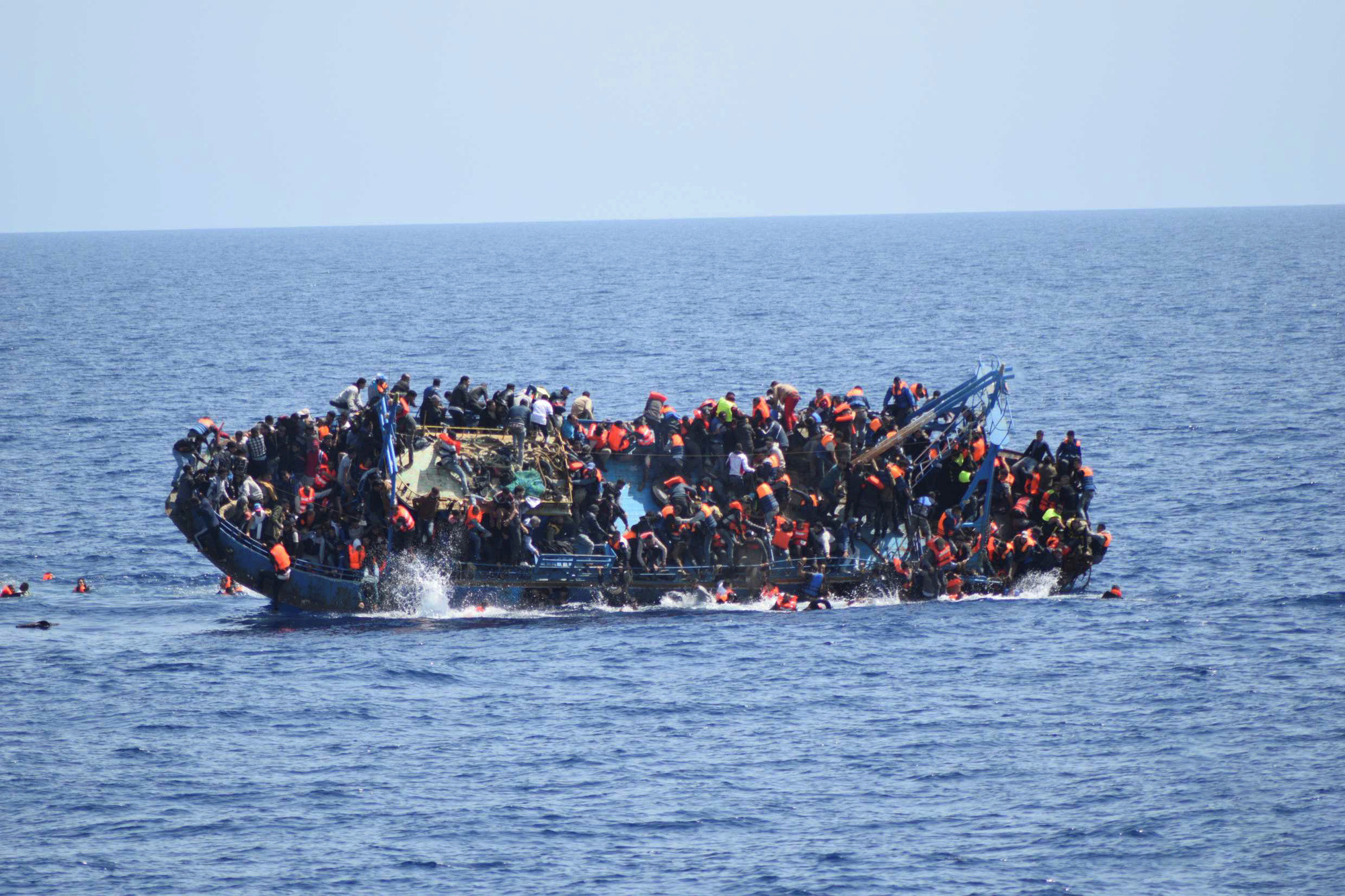 Boat overflowing refugees in the Mediterranean Sea