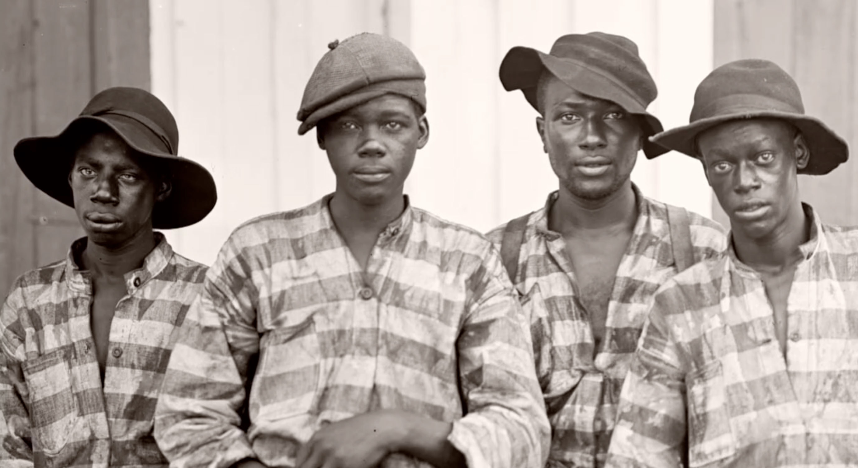 Four black boys looking at camera