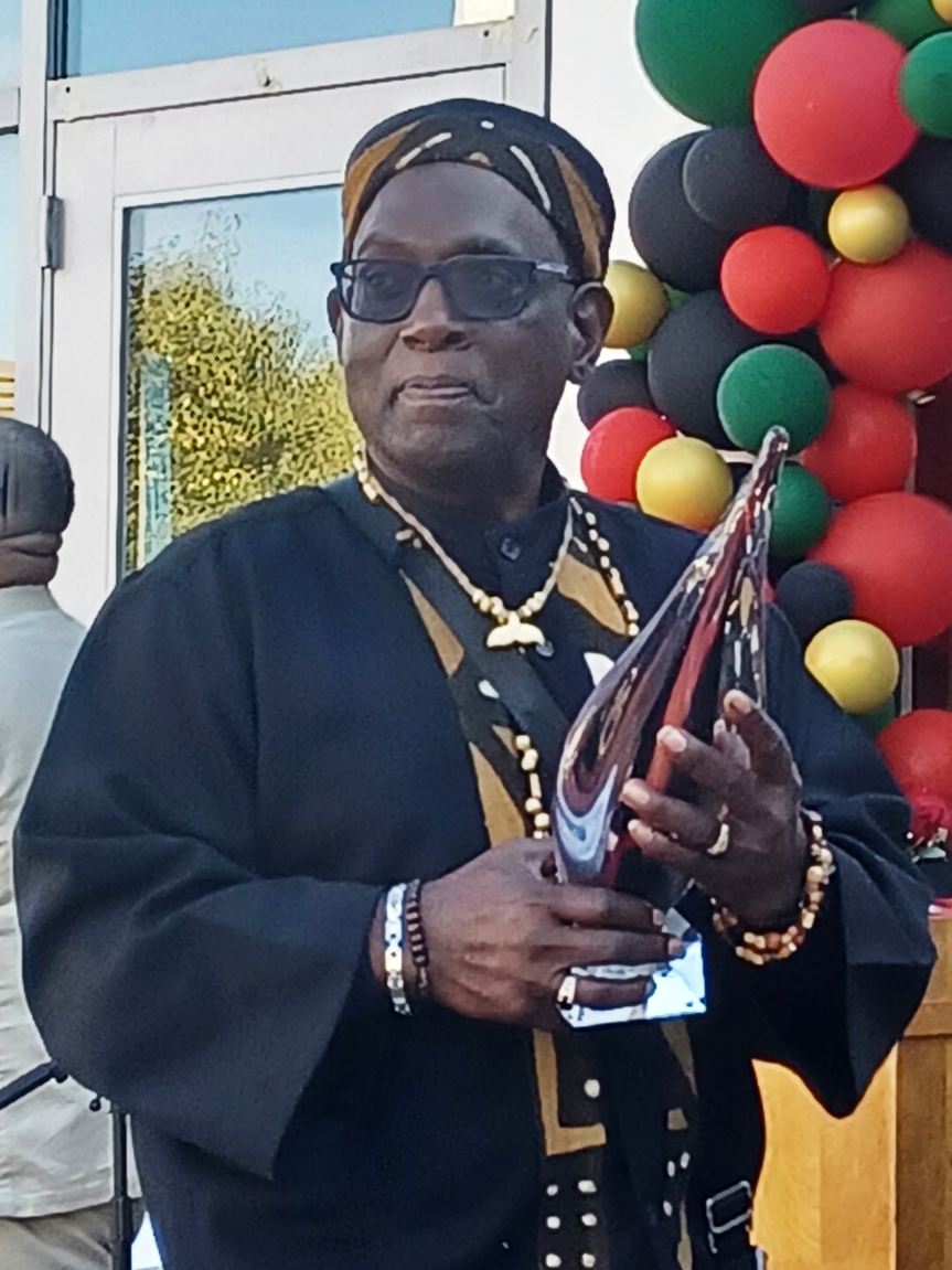 Mr. Stephen Jones holding his award