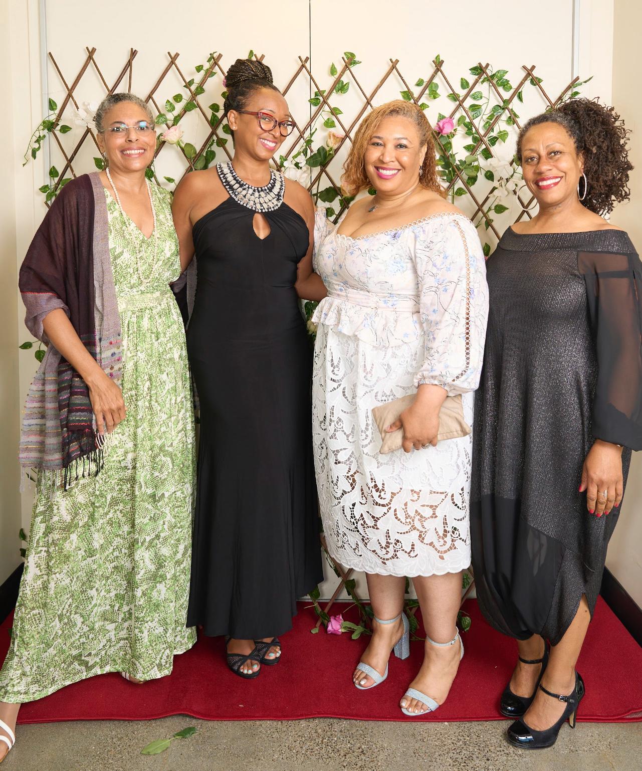 Four beautiful and elegant women posing for photo at Womxn ApprciationNight, UCSB