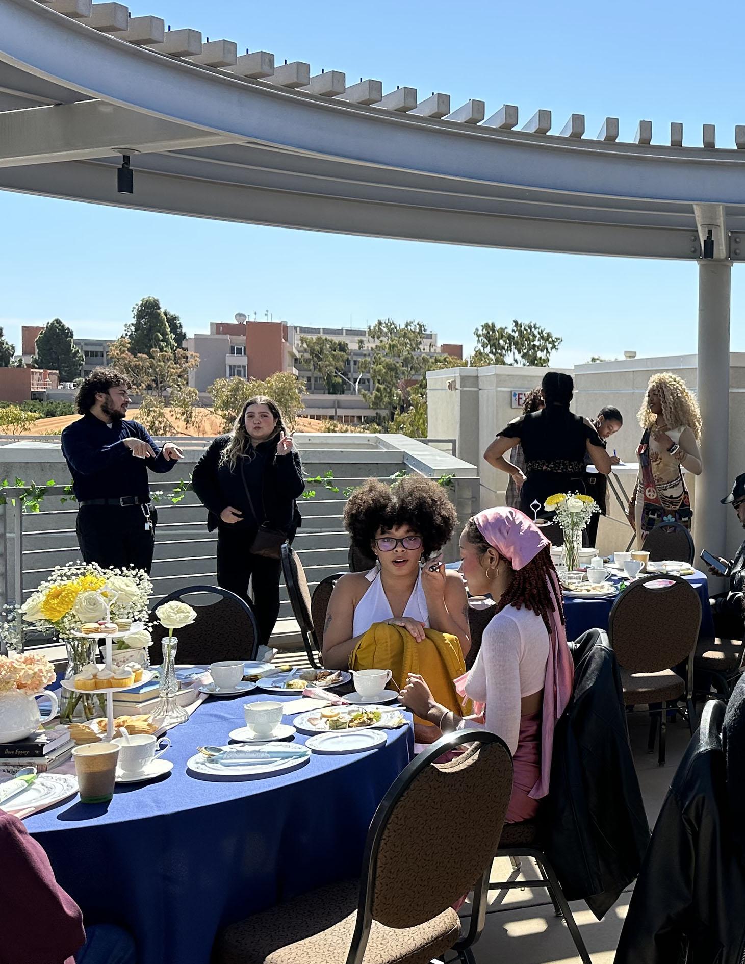 Tea party on one of UCSB campus building terrage. Beautiful sunny day.