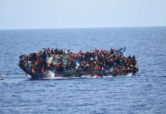 Boat overflowing with refugees in the Mediterranean Sea