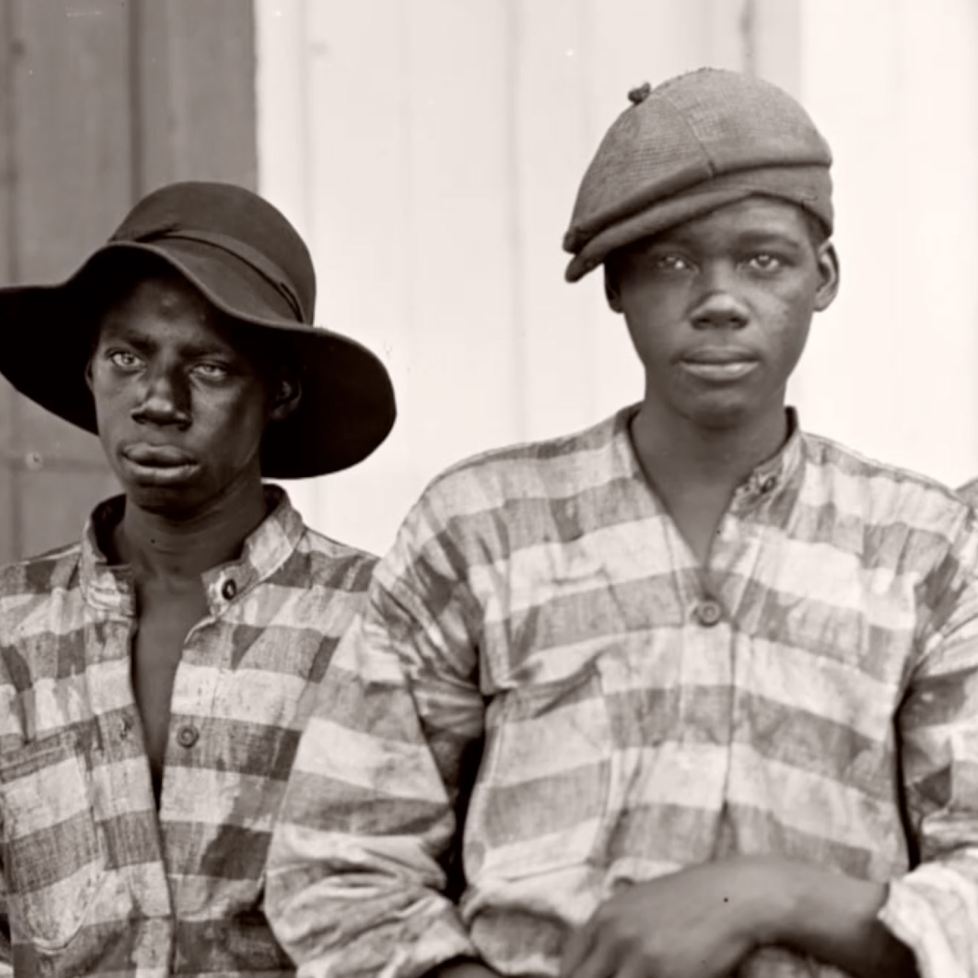 Four black boys looking at camera